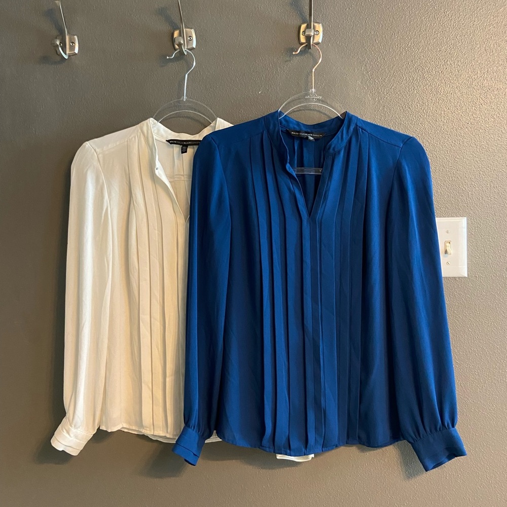 2 blouses - one blue and one white.